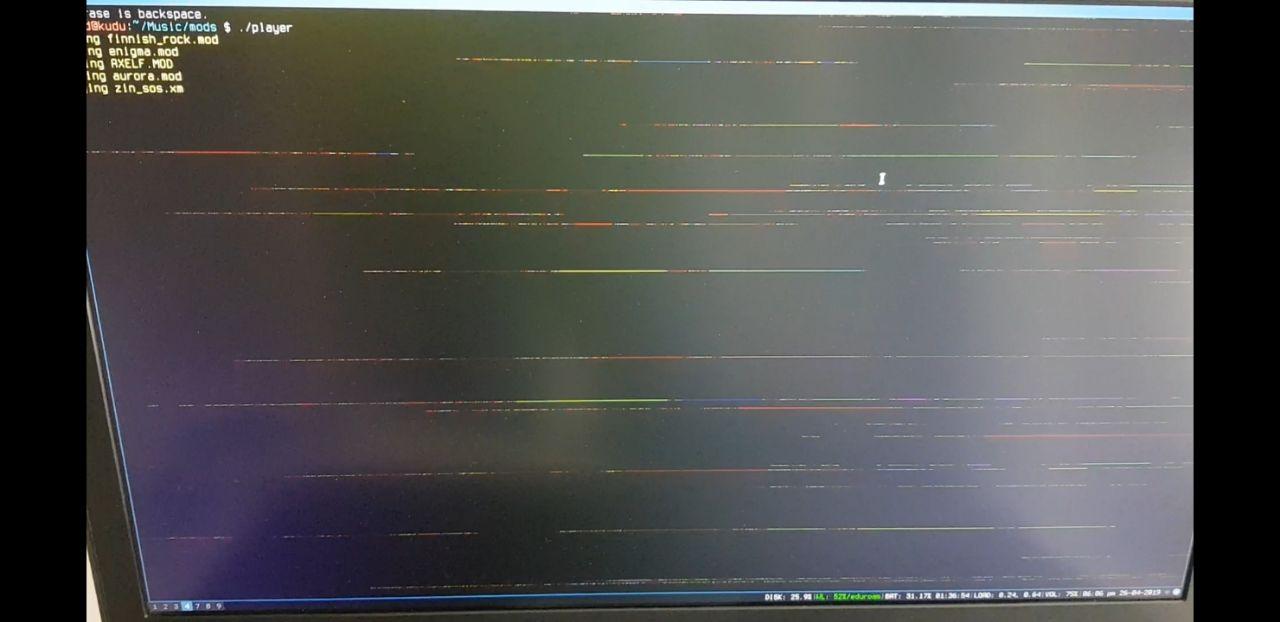 A picture of my laptop screen, showing random horizontal artifacts across different sections of the screen, with different colours